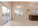 Bright dining area with sliding door leading to backyard at 14529 N 87Th Dr, Peoria, AZ 85381