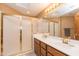 Bathroom boasts double vanity and a shower with glass enclosure at 15225 N Bluejay Pl, Fountain Hills, AZ 85268