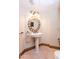 Elegant powder room with pedestal sink and ornate mirror at 15225 N Bluejay Pl, Fountain Hills, AZ 85268