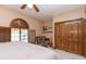 Bright bedroom featuring built-in shelves and wood closet doors at 15225 N Bluejay Pl, Fountain Hills, AZ 85268