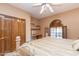 Bedroom with built-in shelves and ceiling fan at 15225 N Bluejay Pl, Fountain Hills, AZ 85268