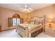 Light and airy bedroom with a ceiling fan and large window at 15225 N Bluejay Pl, Fountain Hills, AZ 85268