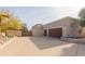 Two-car garage with wood doors at 15225 N Bluejay Pl, Fountain Hills, AZ 85268