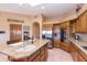 Kitchen island with granite countertop, sink, and seating at 15225 N Bluejay Pl, Fountain Hills, AZ 85268