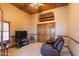 Cozy media room with comfortable seating and built-in shelving at 15225 N Bluejay Pl, Fountain Hills, AZ 85268