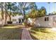 Brick-paved courtyard with BBQ and lush green landscaping at 1531 W Colter St # 10, Phoenix, AZ 85015