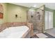 Large bathroom with a soaking tub and glass shower enclosure at 16 W Encanto Blvd -- # 128, Phoenix, AZ 85003