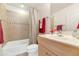 Clean bathroom with shower/tub combo and light wood vanity at 16 W Encanto Blvd -- # 128, Phoenix, AZ 85003