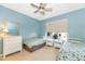 Well-lit bedroom with two twin beds, dresser, and window at 16 W Encanto Blvd -- # 128, Phoenix, AZ 85003