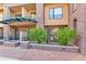 Brick building with manicured landscaping and covered entryway at 16 W Encanto Blvd -- # 128, Phoenix, AZ 85003