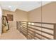 Modern hallway with a metal railing and carpeted flooring at 16 W Encanto Blvd -- # 128, Phoenix, AZ 85003