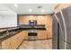 Modern kitchen with stainless steel appliances and granite countertops at 16 W Encanto Blvd -- # 128, Phoenix, AZ 85003