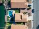 Aerial view of a house with a pool and backyard, located near a lake at 1610 W Maplewood St, Chandler, AZ 85286