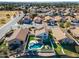 Aerial view of home with pool and backyard, situated near a lake in a neighborhood at 1610 W Maplewood St, Chandler, AZ 85286