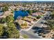 Aerial view of a house near a lake in a residential neighborhood at 1610 W Maplewood St, Chandler, AZ 85286