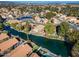 Aerial view of a house near a lake with a community of similar homes at 1610 W Maplewood St, Chandler, AZ 85286