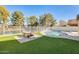 Backyard oasis with a pool, patio furniture, and lake view at 1610 W Maplewood St, Chandler, AZ 85286