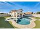 Beautiful backyard with pool, patio, and lush green grass at 1610 W Maplewood St, Chandler, AZ 85286