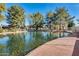 Peaceful community pond with walking path and lush landscaping at 1610 W Maplewood St, Chandler, AZ 85286