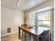 Bright dining area with large windows and wood table at 1610 W Maplewood St, Chandler, AZ 85286