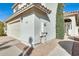 House exterior featuring a two-car garage and walkway at 1610 W Maplewood St, Chandler, AZ 85286