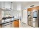 Kitchen features stainless steel appliances and breakfast bar at 1610 W Maplewood St, Chandler, AZ 85286