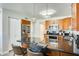 Kitchen with wood cabinets, granite counters, and stainless steel appliances at 1610 W Maplewood St, Chandler, AZ 85286