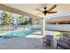 Relaxing patio with pool view, ceiling fan, and outdoor furniture at 1610 W Maplewood St, Chandler, AZ 85286