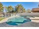 Inviting kidney-shaped pool with large patio and canal view at 1610 W Maplewood St, Chandler, AZ 85286