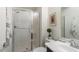 Well-lit bathroom featuring a glass-enclosed shower, modern vanity, and tasteful decor at 1693 E Dogwood Ln, Gilbert, AZ 85295