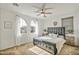 Spacious bedroom with large bed and arched windows at 1693 E Dogwood Ln, Gilbert, AZ 85295