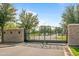 Gated community entrance with decorative iron gate at 1693 E Dogwood Ln, Gilbert, AZ 85295