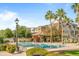 Relaxing community pool with lounge chairs and palm trees at 1693 E Dogwood Ln, Gilbert, AZ 85295