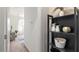 Hallway view of a decorated shelf leading to living area with plenty of light at 1693 E Dogwood Ln, Gilbert, AZ 85295