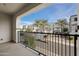 Private balcony with view of the community and palm trees at 17680 N 77Th Pl, Scottsdale, AZ 85255