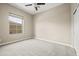 Bright bedroom with ceiling fan and large window at 17680 N 77Th Pl, Scottsdale, AZ 85255