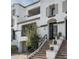 Two-story home with Spanish-style architecture and a private staircase at 17680 N 77Th Pl, Scottsdale, AZ 85255