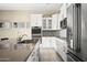 Modern kitchen with white cabinets and a large island at 17680 N 77Th Pl, Scottsdale, AZ 85255