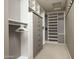 Large walk-in closet with ample shelving and drawers at 17680 N 77Th Pl, Scottsdale, AZ 85255