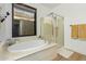 This bathroom features a luxurious soaking tub, a shower with glass enclosure, and a bright window at 1885 W Dion Dr, Phoenix, AZ 85086