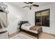 Bedroom featuring a minimalist design with light wood floors, a window, and simple furnishings at 1885 W Dion Dr, Phoenix, AZ 85086