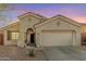 Charming single-story home with desert landscaping, a two-car garage, and a covered front porch at 1885 W Dion Dr, Phoenix, AZ 85086