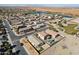 Aerial view of house, neighborhood, and distant lake at 19371 N Nocera Rd, Maricopa, AZ 85138