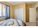 Bedroom with double door closet and window coverings at 19371 N Nocera Rd, Maricopa, AZ 85138