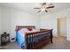 Bedroom with wooden bed frame and ample closet space at 19371 N Nocera Rd, Maricopa, AZ 85138