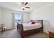 Spacious bedroom with carpeted floor, ceiling fan and large window at 19371 N Nocera Rd, Maricopa, AZ 85138