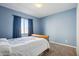 Light blue bedroom with double bed and window coverings at 19371 N Nocera Rd, Maricopa, AZ 85138