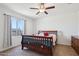 Bright bedroom featuring a wooden bed frame and a ceiling fan at 19371 N Nocera Rd, Maricopa, AZ 85138