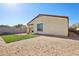 Rear exterior view showing home and grassy area at 19371 N Nocera Rd, Maricopa, AZ 85138