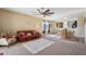 Open living room and dining area with a leather couch at 19371 N Nocera Rd, Maricopa, AZ 85138